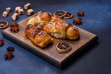 Delicious homemade pastries with apricot jam sprinkled with sesame seeds