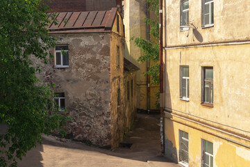 House facades on a narrow street of Viborg by summer day