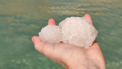 hand with  salt ice dead sea nature 