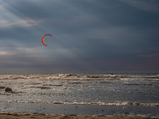 Kite Surfer heading towards sunrays prior to sunset