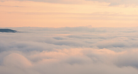 Flight high above the clouds. Landscape in the Ukrainian Carpathians