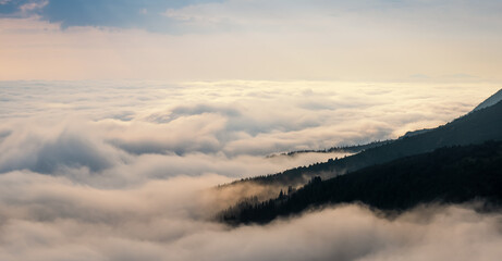 Flight high above the clouds. Landscape in the Ukrainian Carpathians