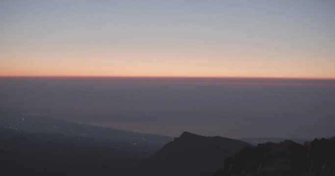 Panoramic view of the eastern coast of Sicily from Mount Etna at dawn.