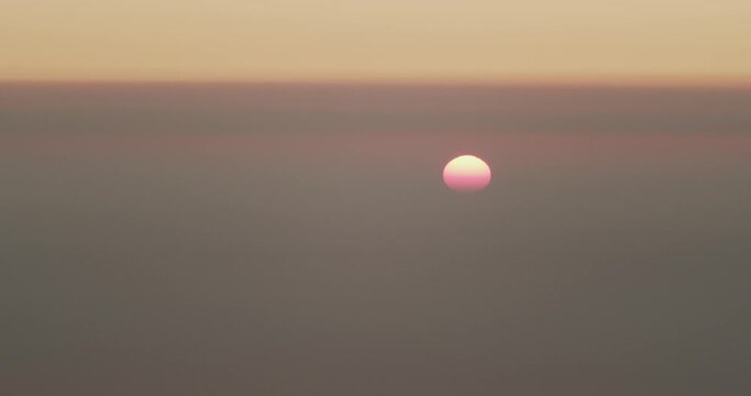 Sun rising from the horizon seen from Etna