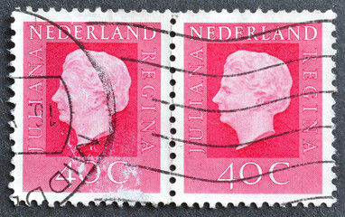 Cancelled postage stamp printed by Netherlands, that shows Queen Juliana Regina, circa 1972.