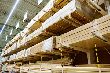 wooden boards and slabs in the warehouse of the hardware store. 