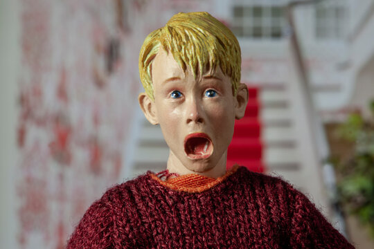 NEW YORK USA _ AUG 27 2022: recreation of a scene from the Christmas movie Home Alone, with Kevin McCallister yelling expression as he realizes he is alone  - Neca action figure