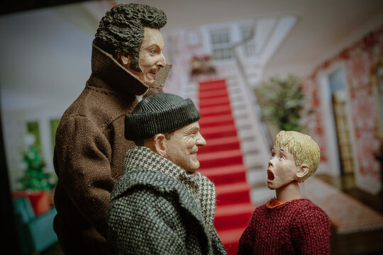 NEW YORK USA, AUG 27 2022: recreation of a scene from the Christmas movie Home Alone, Kevin McCallister yelling expression as he realizes he is alone with Harry and Marv, the Wet Bandits - Neca figure