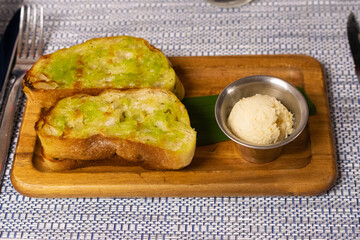 Grilled ciabatta bread with roasted garlic-manchego butter