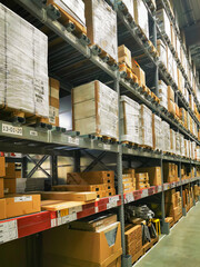 Typical large warehouse with long shelves filled with packaged goods