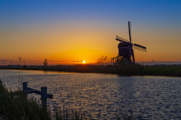 Sunset with windmill Broekmolen, Molenlanden - Nieuwpoort, The Netherlands