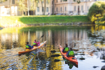 A process of kayaking in the city river canals, with colorful canoe kayak boat paddling, process of...