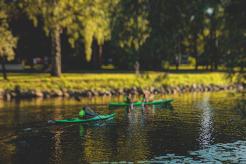 A process of kayaking in the city river canals, with colorful canoe kayak boat paddling, process of...