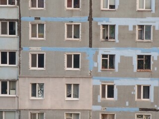 Fototapeta na wymiar fragment of a multi-storey building of Soviet architecture