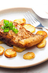 carp on cumin with fried potatoes