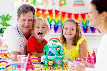 Child birthday party cake. Family with kids.