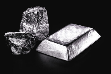 palladium stone and ingot, a transition metal used in the production of aerospace equipment, black background, isolated - obrazy, fototapety, plakaty