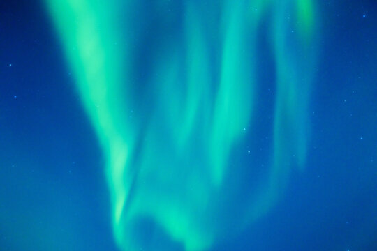Sky background with northern lights. Aurora borealis. Northern lights as a background. Night winter landscape with aurora. Natural background.