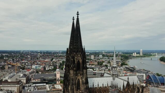 Overview of the spiers of the Cathedral of Saints Peter and Mary, panoramic bird's eye view from a drone. Cologne Cathedral in the historic city center. Cologne, Germany