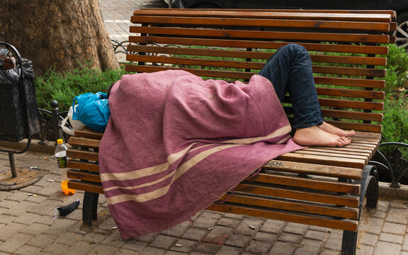 homeless on the streets of the city. - Powered by Adobe