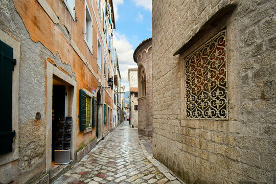 A narrow stone alley alongside the The Cathedral of Saint Tryphon in Kotor, Montenegro.