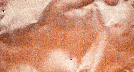 Rust texture. Rusty crumpled iron. Sheet of iron rust, orange in the sun.