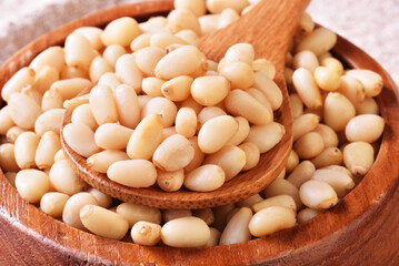 Pine nuts on the wooden table. Healthy food. 