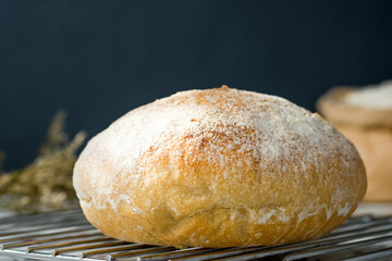 Ciabatta bread on oven tray on terrazzo counter in kitchen