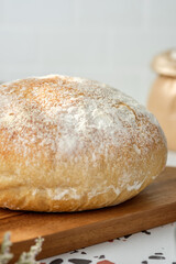 Ciabatta bread on oven tray on terrazzo counter in kitchen