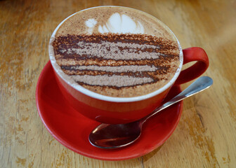 A large mocha in a red cup