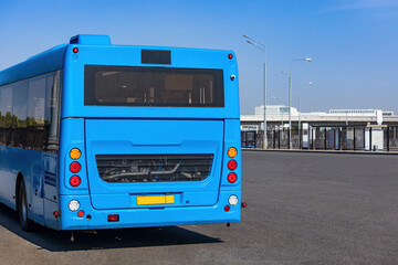 Blue electric bus on the public transport station 