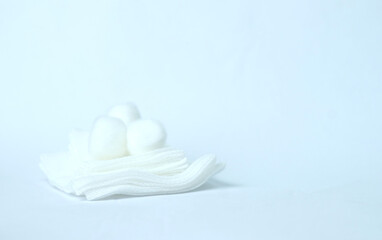 sterile gauze with  cotton balls on top selective focus