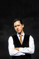 Handsome and elegant Latin American young man poses outdoors with solid backgrounds for design, with great attitude in Venezuela