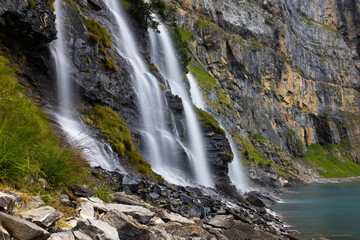 Mystic waterfall at Lake Oeschinen in the Bernese Alps, Switzerland 