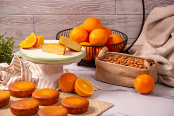 Homemade orange bread keto recipe. Decoration with fresh oranges and almonds