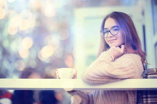 girl spring cafe portrait, happy young model posing with a cup of coffee, spring look