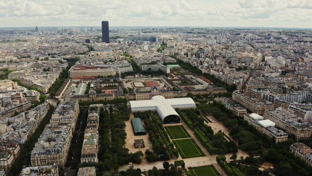 Cityscape of Paris from a bird's eye view. Drone flies in the historic city center over the Champ de Mars and an Ecole Militaire, France, Paris