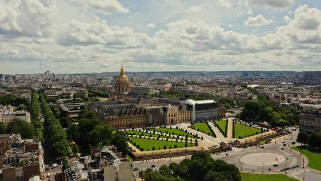 Architectural complex and park area of Les Invalides in the historic center of Paris, bird's eye view video on a cloudy day. Cityscape of Paris from drone, France