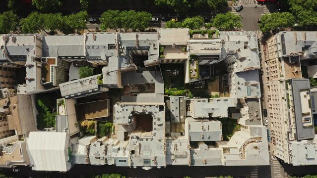 Closed courtyards of residential buildings in the center of Paris. Top view of the roofs of traditional houses in the historic city center. France, Paris, drone video