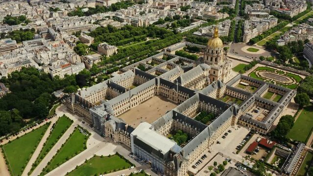 Architectural complex and park area of Les Invalides in the historic center of Paris, bird's eye view video on a cloudy day. Cityscape of Paris from drone, France
