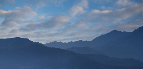 Fototapeta premium Mountains behind the village of Lumio Corsica on the mediterranean sea