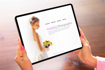 Woman viewing portfolio website of a wedding photographer