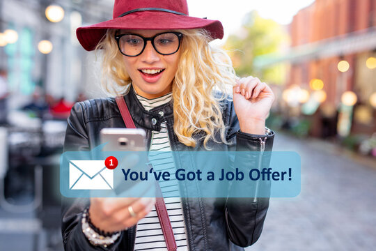 Excited girl receiving a message with a new job offer