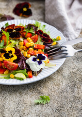Vegetable salad with edible flowers