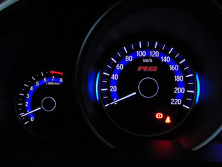 speedometer on black background