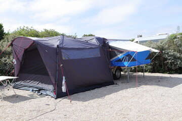 an folding caravan on a campsite  - obrazy, fototapety, plakaty