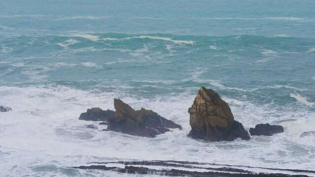 Rocky coast of Cantabria; huge waves breaking on the sea-stacks off the Cantabrian coast in the vicinity of the village of Liencres. 