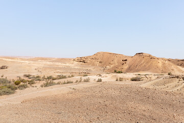 Fototapeta na wymiar The majestic beauty of the boundless stone Judean desert in southern Israel