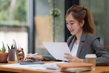Modern business woman analysis financial paperwork document