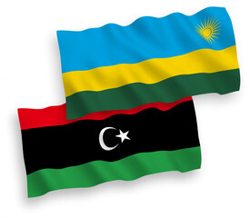 National vector fabric wave flags of Republic of Rwanda and Libya isolated on white background. 1 to 2 proportion.